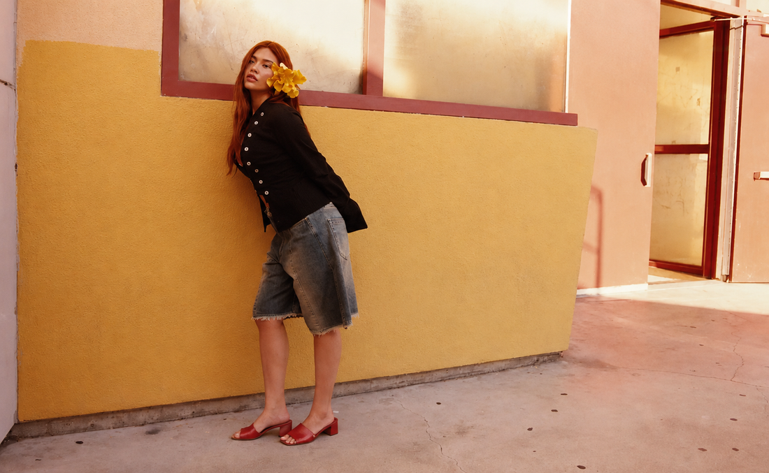 Actress Myra Molloy wearing Thália Kelly Block Heel Mules in Cherry Burgundy, styled for her Cero Magazine editorial shoot — PETA-approved vegan luxury shoes by Thalia.
