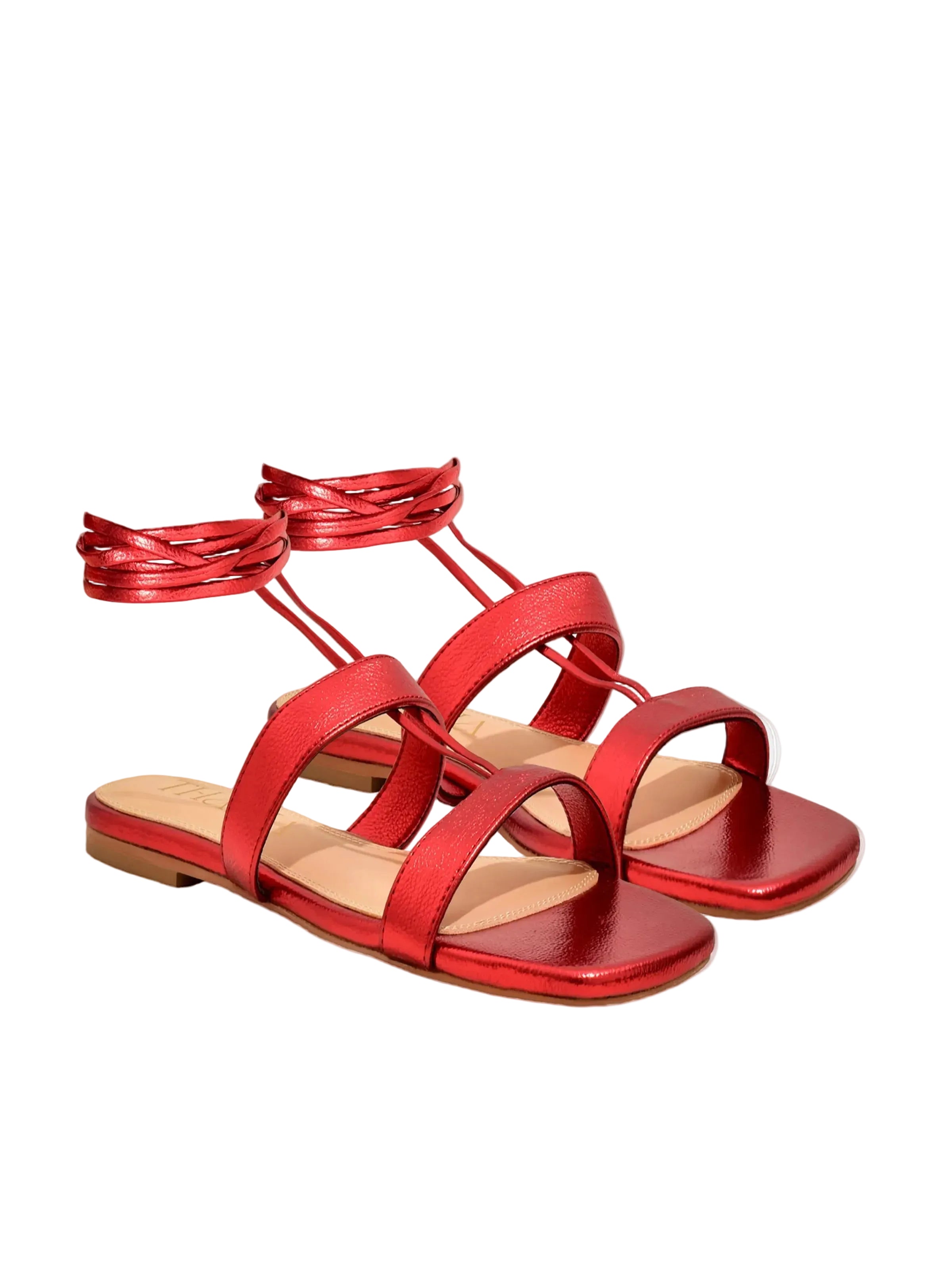 Metallic Red Greek tie-up sandals worn – PETA-approved vegan footwear by Thália
